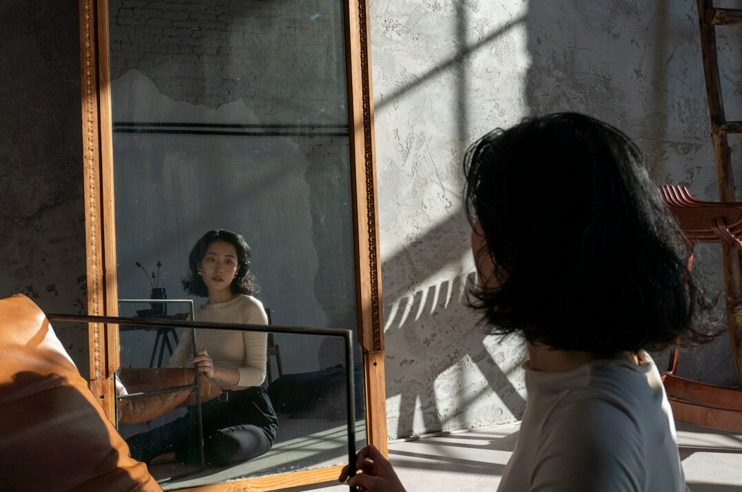 person practicing speech in mirror