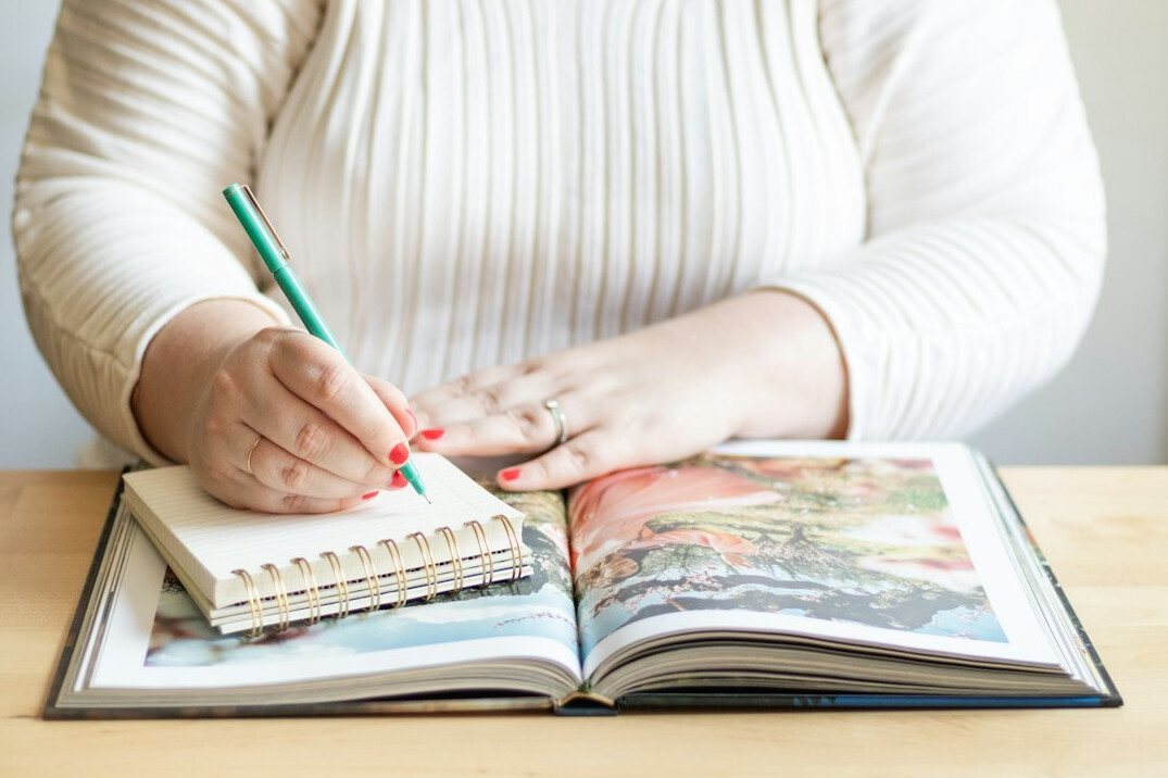 woman writing in notebook